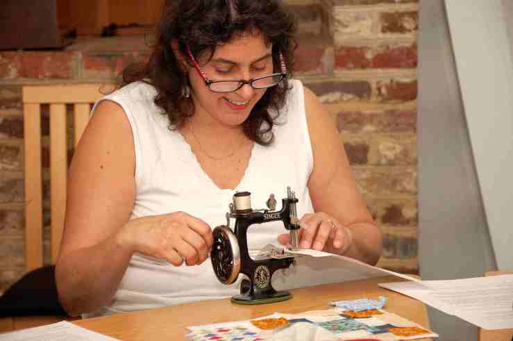 Helena Cora Moran participating in the Early Sewing Machine workshop. Helena is also a volunteer at HSMC and helped set up and take down the machines for the workshop.