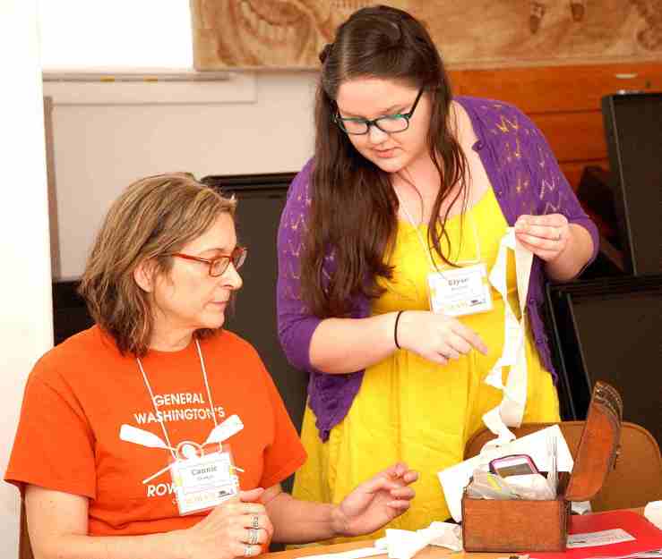 Connie Unangst and Elyse Bennett work on ruffles during the "Making an 18th Century Cap" workshop