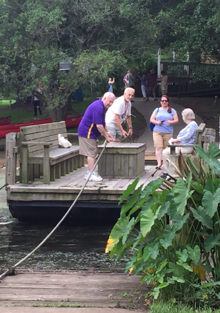 Ron Kley gallantly drags a ferry by rope across the water so Jane Radcliffe can disembark on the other side. ALHFAM members: always willing to go the extra mile.
