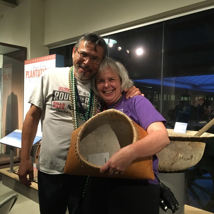 Karen Clancy was the happy winner of the birch bark basket made by Del Taylor
